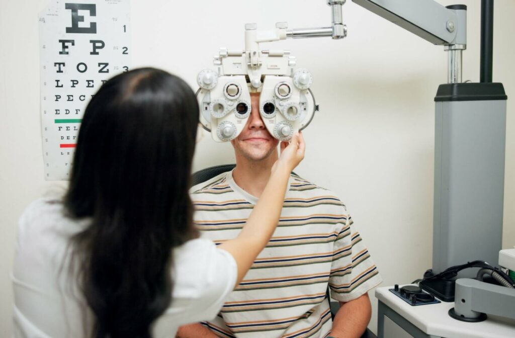 An adult gets an eye exam to ensure their eyeglasses prescription is current.