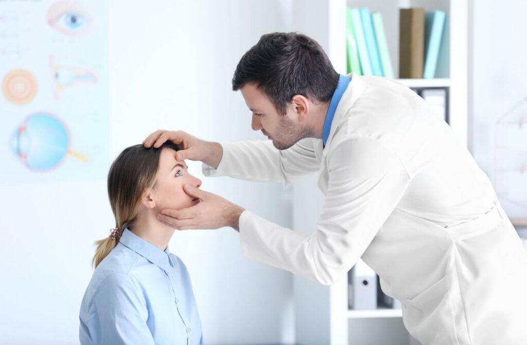 Optometrist examining a patient's eyes for signs of dry eye disease during an in-office visit.