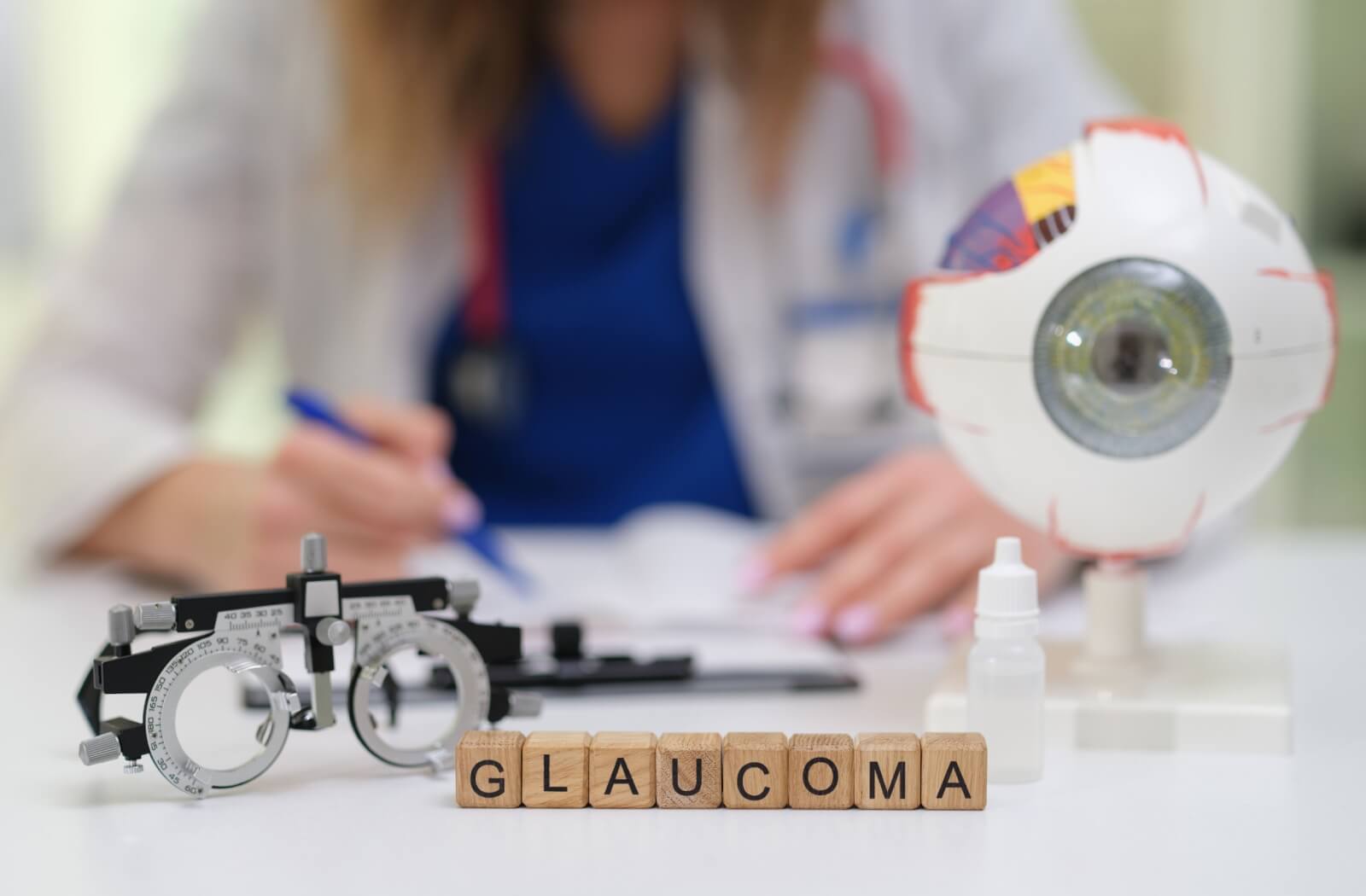 Close-up of glaucoma concept with eye model and diagnostic tools